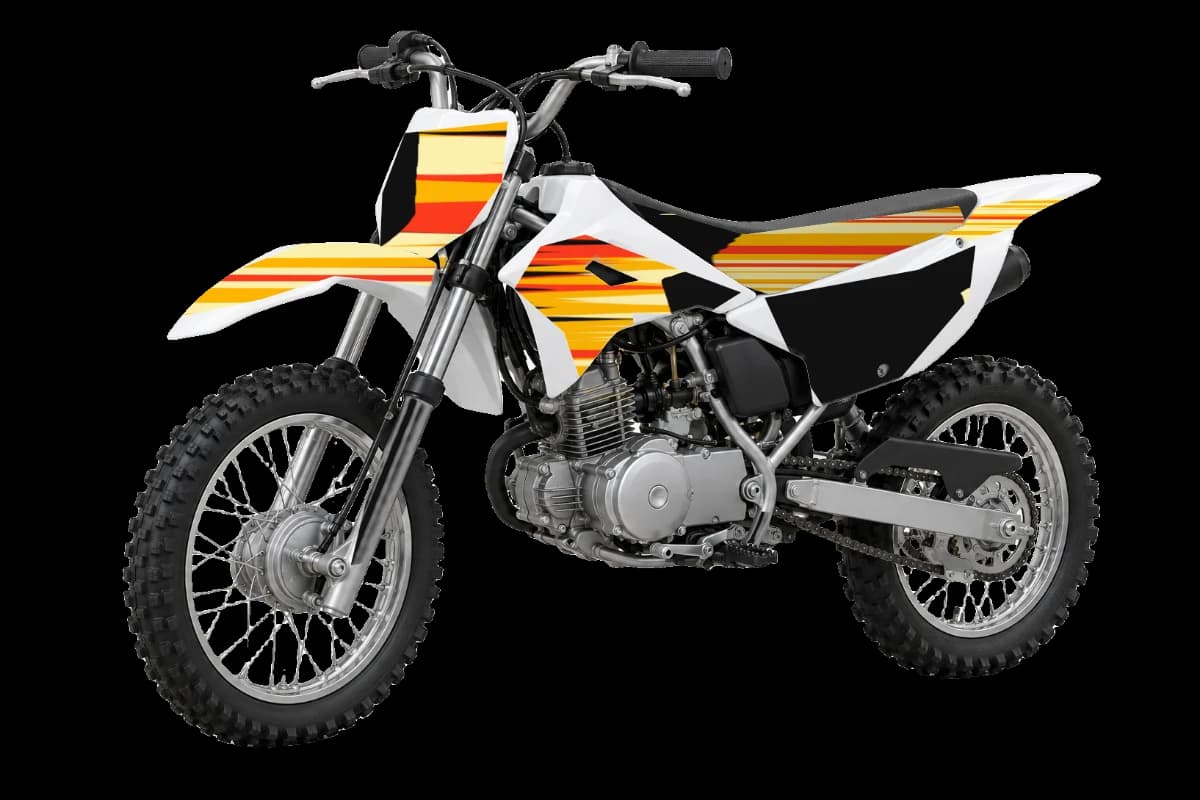 Flame style dirt bike graphics kit on a Kawasaki KLX110R