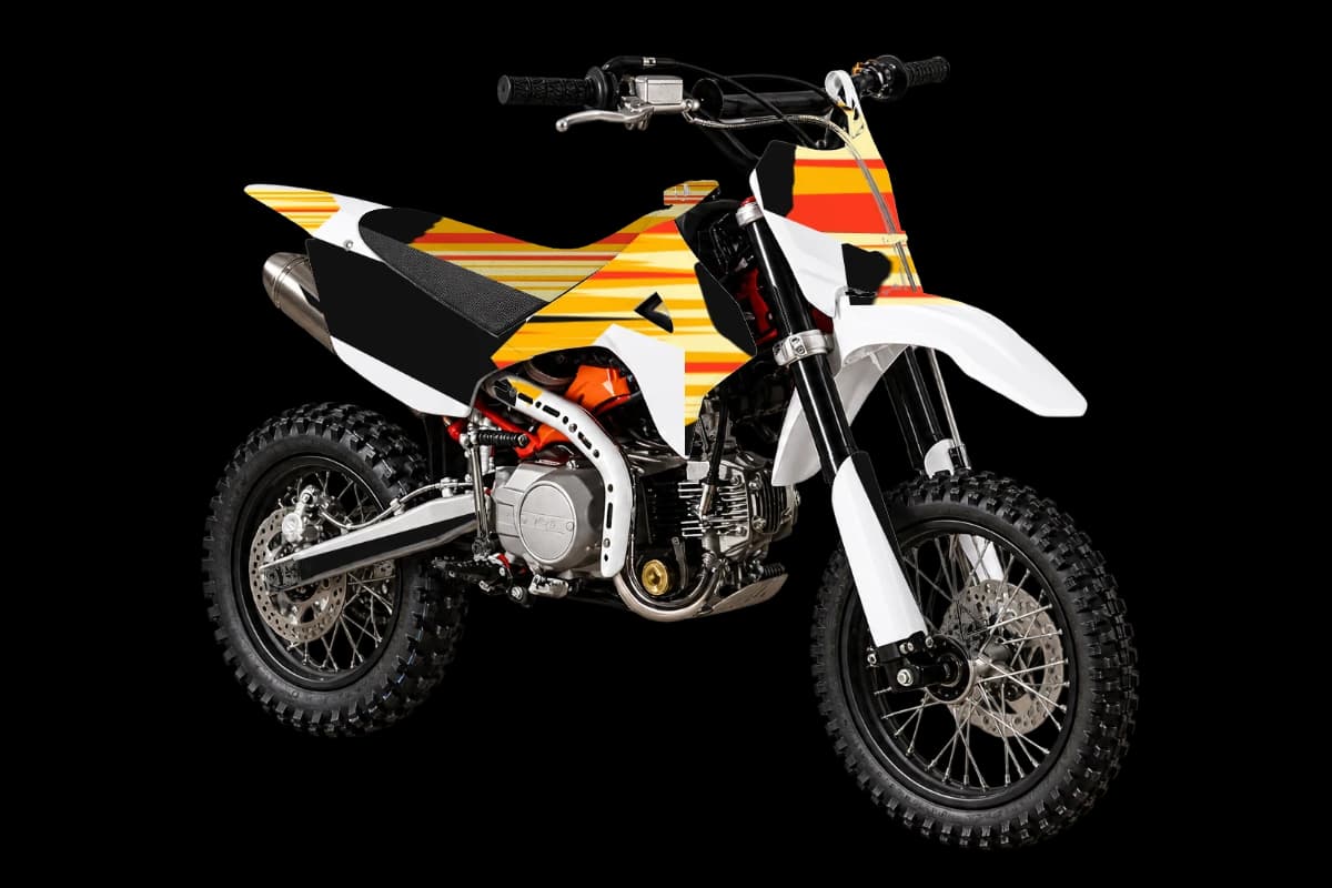 Flame style dirt bike graphics kit on a Kayo TD110