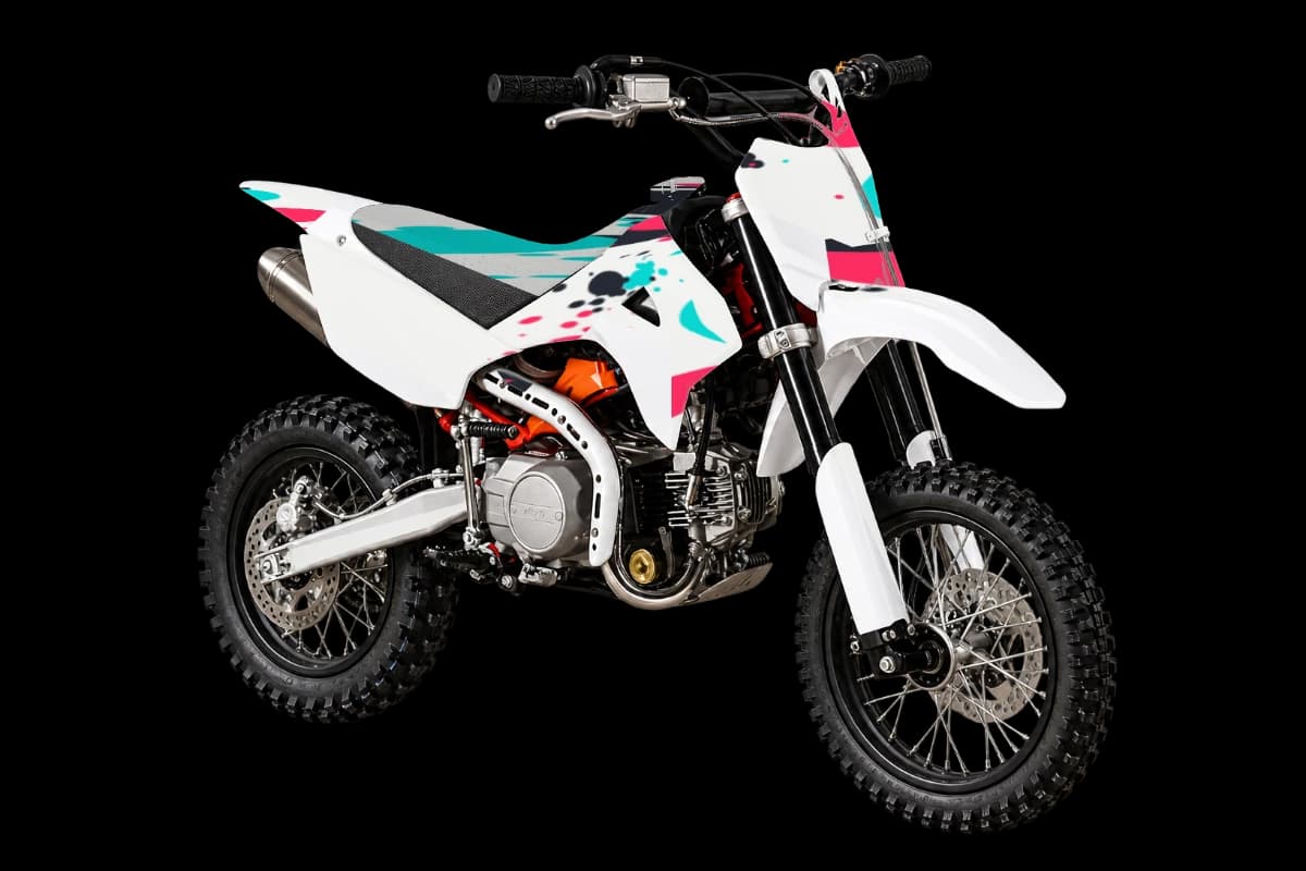 Paint splatter style dirt bike graphics kit on a Kayo TD110