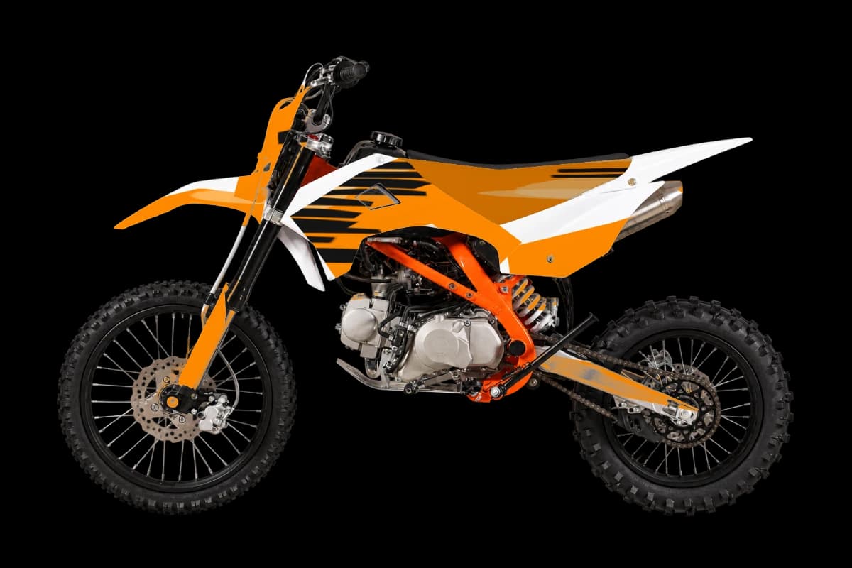 Tiger stripe style dirt bike graphics kit on a Kayo TT125
