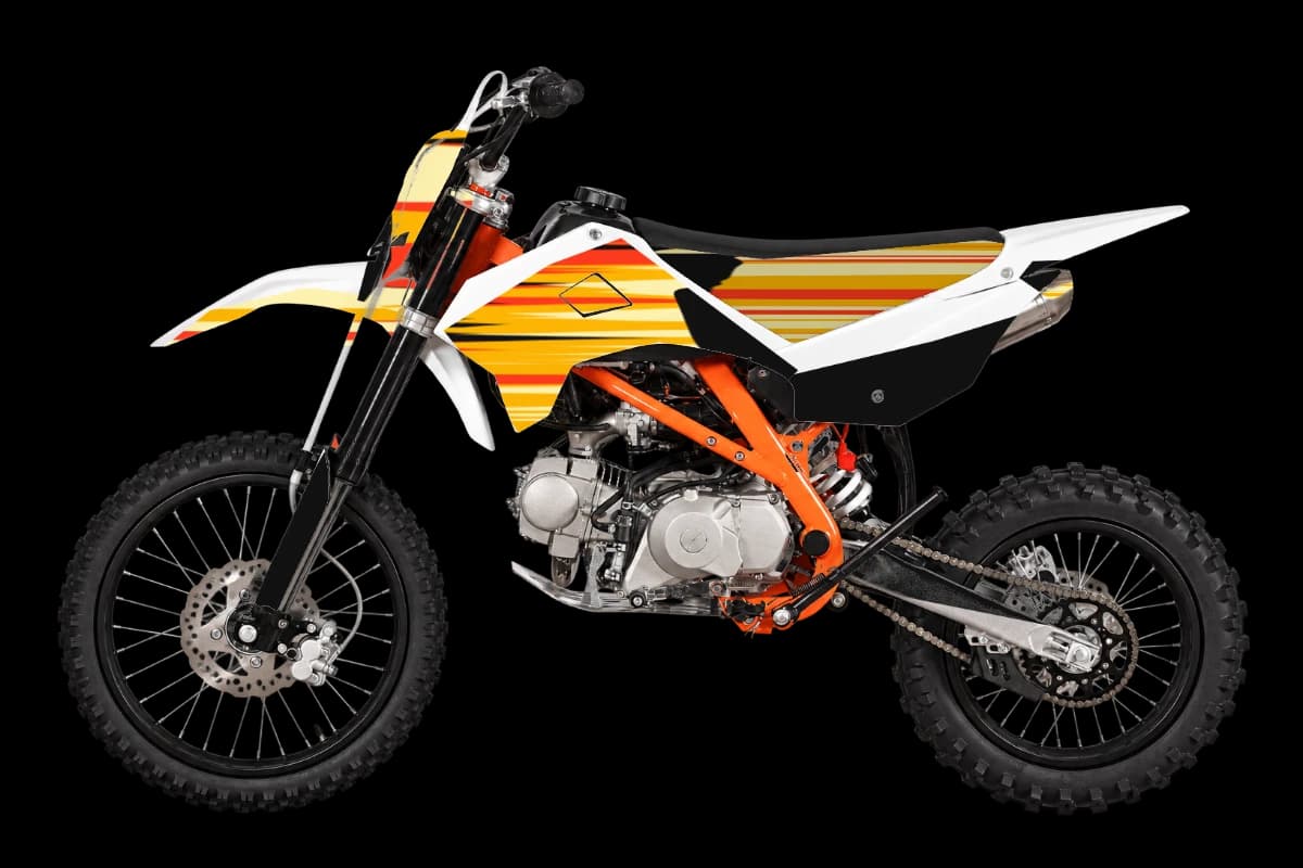 Flame style dirt bike graphics kit on a Kayo TT140