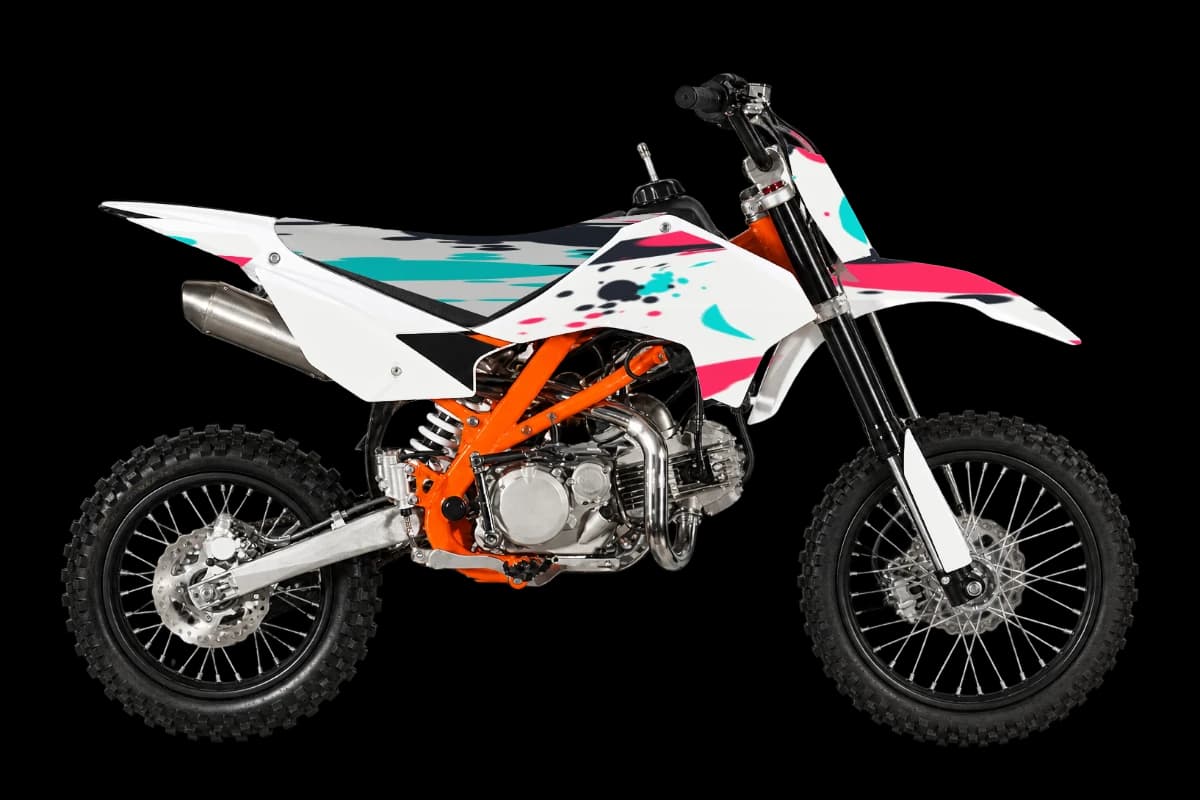 Paint splatter style dirt bike graphics kit on a Kayo TT160