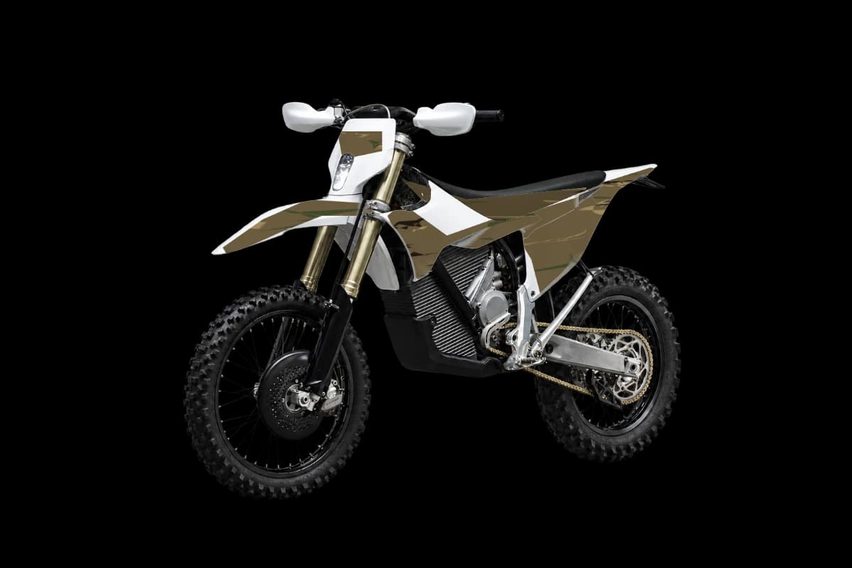 Woodland camo style dirt bike graphics kit on a Stark Varg EX