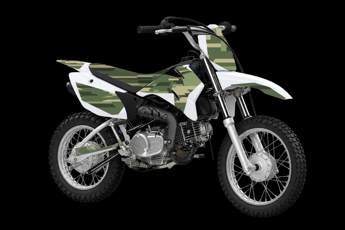 Digital camo style dirt bike graphics kit on a Yamaha TT-R110E