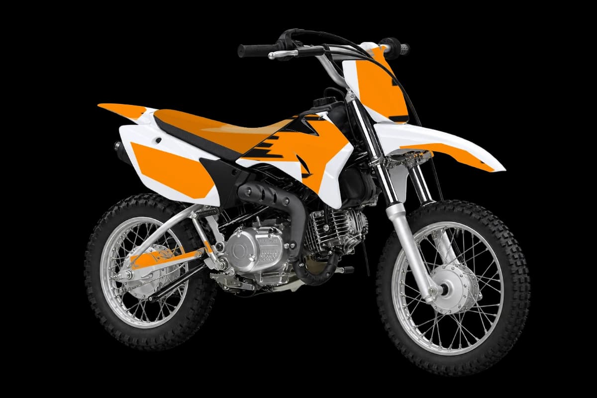 Tiger stripe style dirt bike graphics kit on a Yamaha TT-R110E