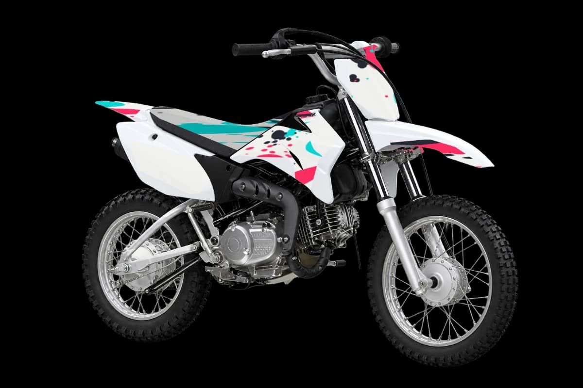 Paint splatter style dirt bike graphics kit on a Yamaha TT-R110E