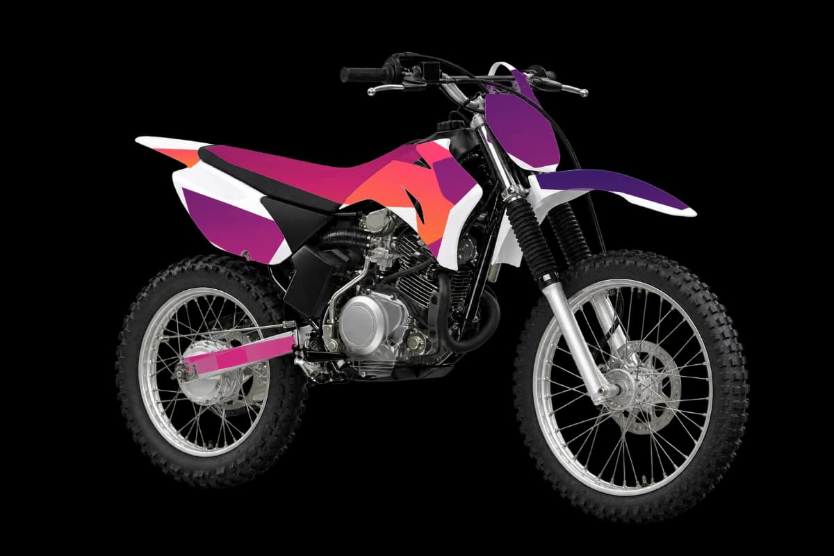 Gradient fade style dirt bike graphics kit on a Yamaha TT-R125LE